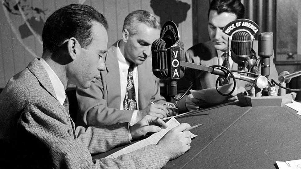 Broadcasters at the Voice of America microphones