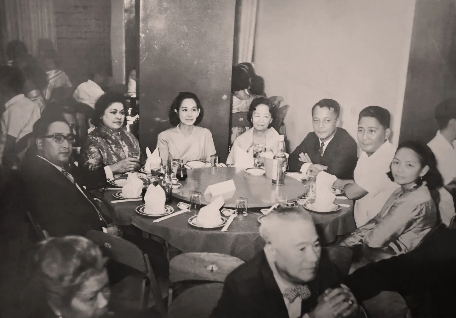 Coring at a Chuidian family reunion, seated between Corito and Hadji